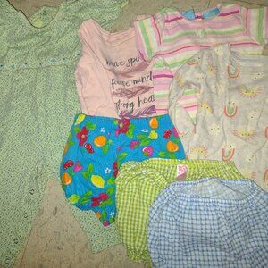 A one-piece outfit, three shirts and three panties, 12-18 months.